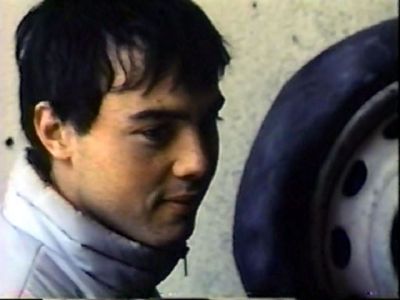 A young man returns Mona's look.