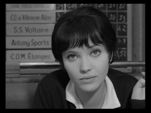 Nana looks directly at the camera.